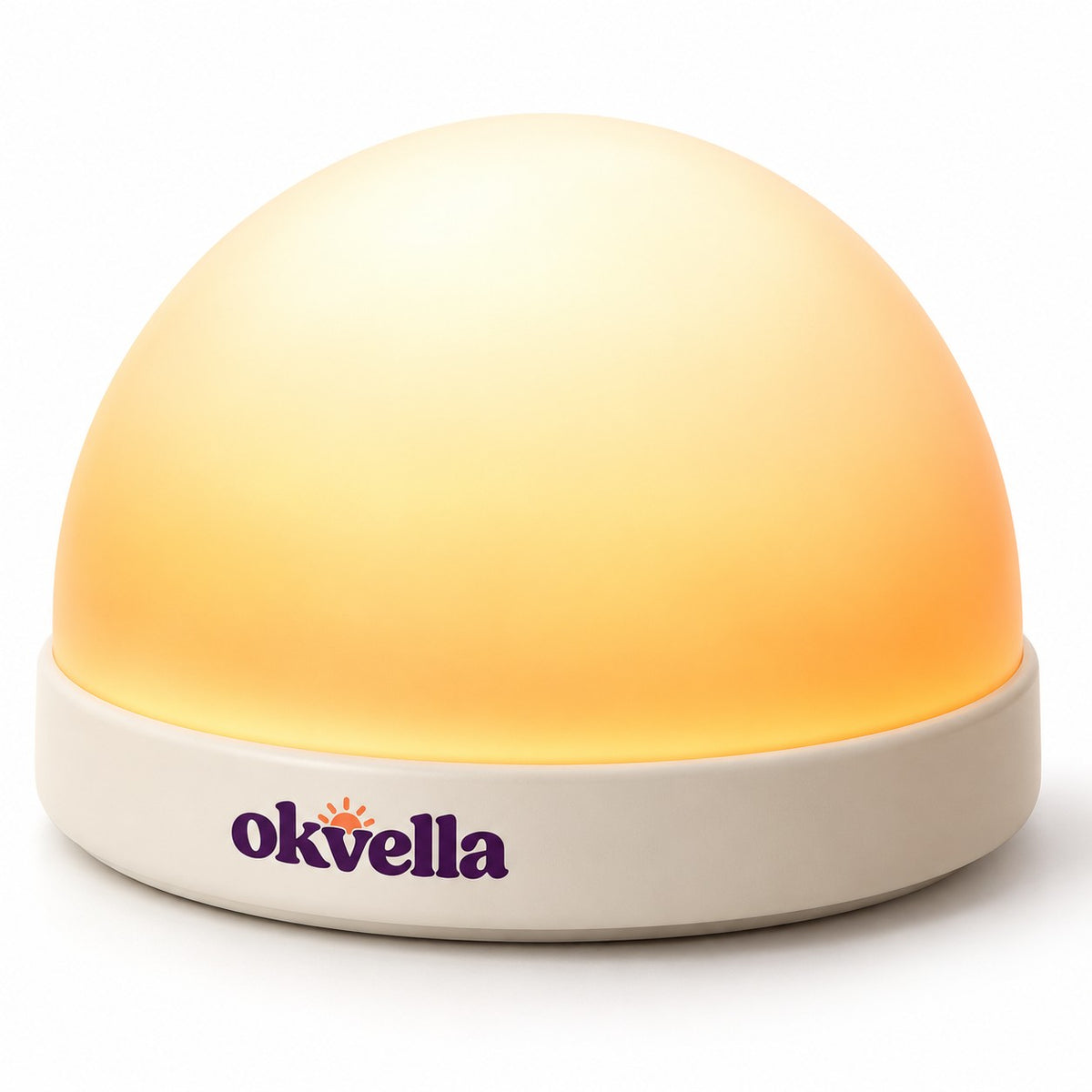 okvella sunrise wake-up light with frosted dome glowing amber on a cream base