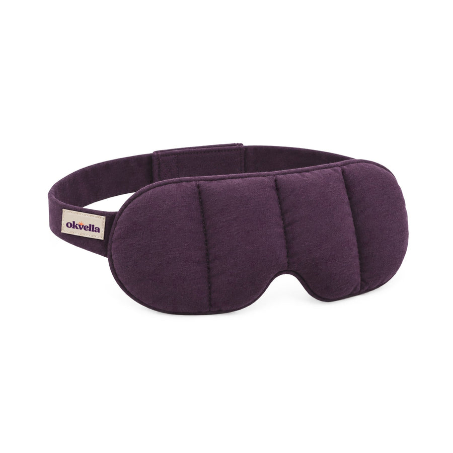 okvella Weighted Sleep Mask in plum cotton jersey with four padded channels and the okvella label on the strap